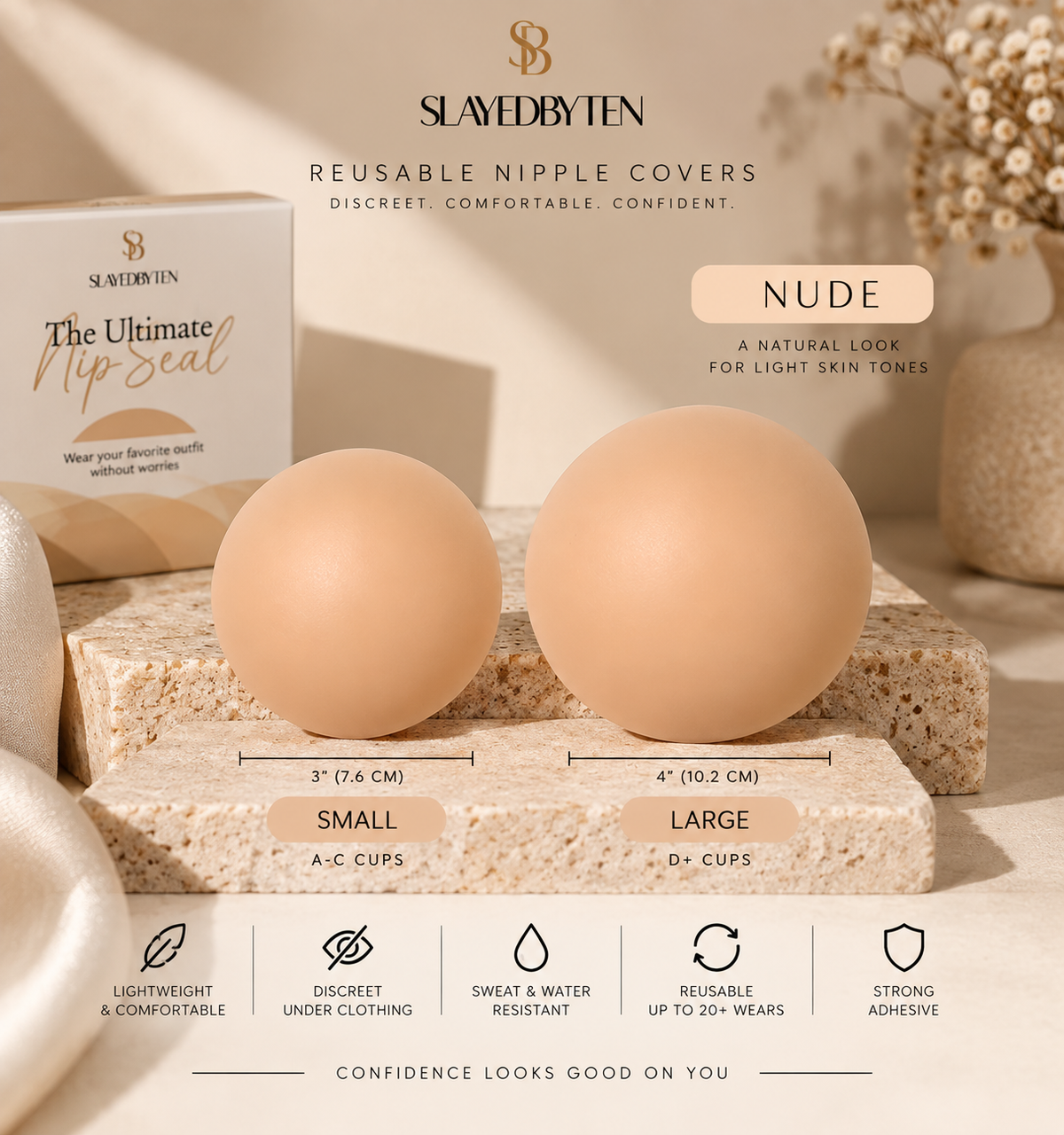 Slaved by Ten reusable nipple covers in Nude color, shown as two smooth oval silicone covers labeled Small and Large on a textured stone block, with the product box and branding visible in a styled studio setting.
