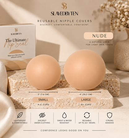Slaved by Ten reusable nipple covers in Nude color, shown as two smooth oval silicone covers labeled Small and Large on a textured stone block, with the product box and branding visible in a styled studio setting.